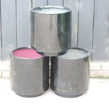 A set of three black garden pots,