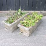 A pair of stone troughs,