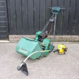 A Qualcast petrol lawnmower,