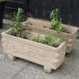 A pair of reconstituted stone garden troughs,