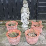 A set of three reconstituted stone garden pots,