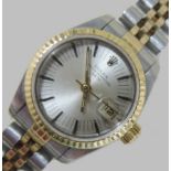 A Rolex gold and steel cased ladies wristwatch, the silvered dial with baton hours,