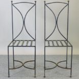 A set of four iron framed dining chairs