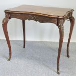 An early 20th century French gilt mounted shaped occasional table,