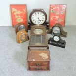 A collection of mantel clocks,