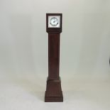 An early 20th century mahogany granddaughter clock,