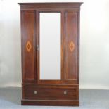 An Edwardian mahogany and inlaid single wardrobe,