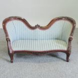 A miniature carved mahogany and green upholstered double ended chaise,