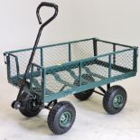 A green painted metal garden cart,