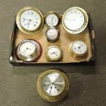 A collection of ships bulkhead clocks, together with a compass,