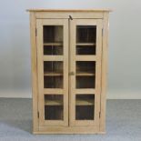 A pine glazed bookcase,