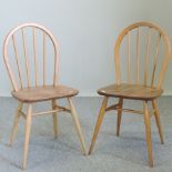 A set of four Ercol light elm spindle back dining chairs