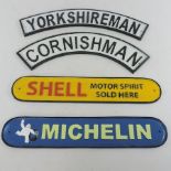 A collection of four painted metal advertising signs,