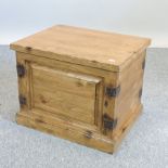 A modern pine trunk, with a hinged lid,