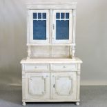 A white painted glazed dresser, with cupboards below,