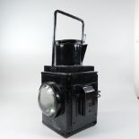 An early 20th century black painted railway lamp, marked BR (W),