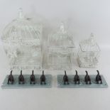 A graduated set of three white painted metal birdcages, tallest 43cm high,