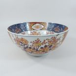 A Chinese porcelain bowl, decorated with flowers, printed marks to base, 25cm diameter,