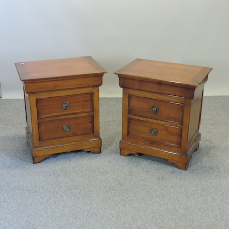 A pair of cherrywood bedside cabinets,