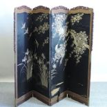 An early 20th century Chinese four fold dressing screen, 220cm overall,