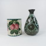 A Wemyss pot, together with a Brannam pottery green glazed vase,
