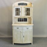 A white painted bow front dresser,