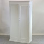 An antique pine and later white painted pine double wardrobe,