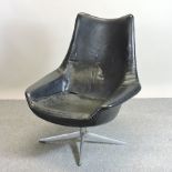 A 1960's swivel armchair, bearing a label for Bramin,