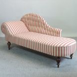 A Victorian red and white upholstered chaise longue, on turned legs,