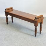 A Regency style mahogany window seat, on turned legs,