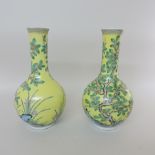 A pair of oriental famille jaune vases,