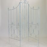 A blue painted metal folding garden screen,