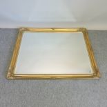 A gilt framed wall mirror,