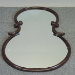 An antique style carved mahogany framed wall mirror,