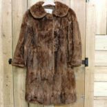 A ladies fur coat,