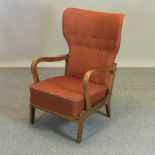 A 1950's high back open armchair