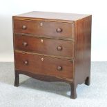 A 19th century mahogany and satinwood banded chest, containing three long drawers,