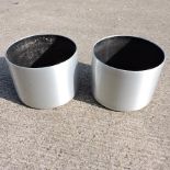 A set of two brushed aluminium painted garden pots,