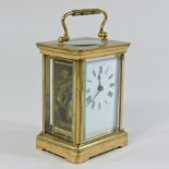 A French brass cased carriage clock, with key,