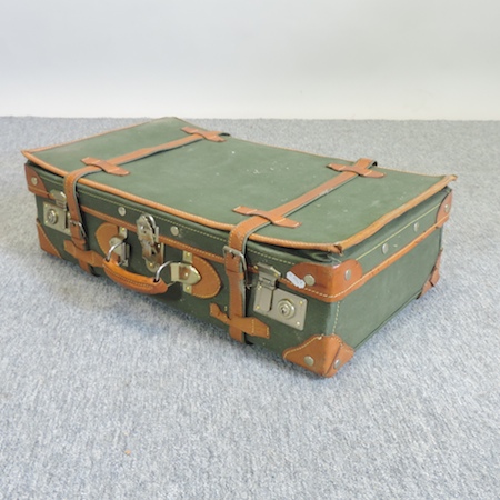 A vintage canvas and leather case,