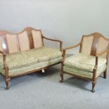 An early 20th century sofa, with a single cane back and green cushions, 120cm,