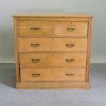 An Edwardian ash chest of drawers,