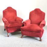 A pair of early 20th century red upholstered Queen Anne style armchairs,