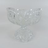 An early 20th century cut glass punch bowl on stand,