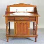 A modern mahogany washstand and basin,