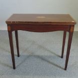 An Edwardian mahogany and inlaid card table,