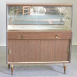 A 1950's glazed cabinet,