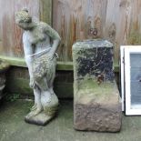 A reconstituted stone figure of a lady, together with a carved stone plinth,