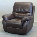 A brown leather upholstered reclining armchair