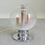 An Italian glass globe table lamp, with coloured bulbs on a chrome base,